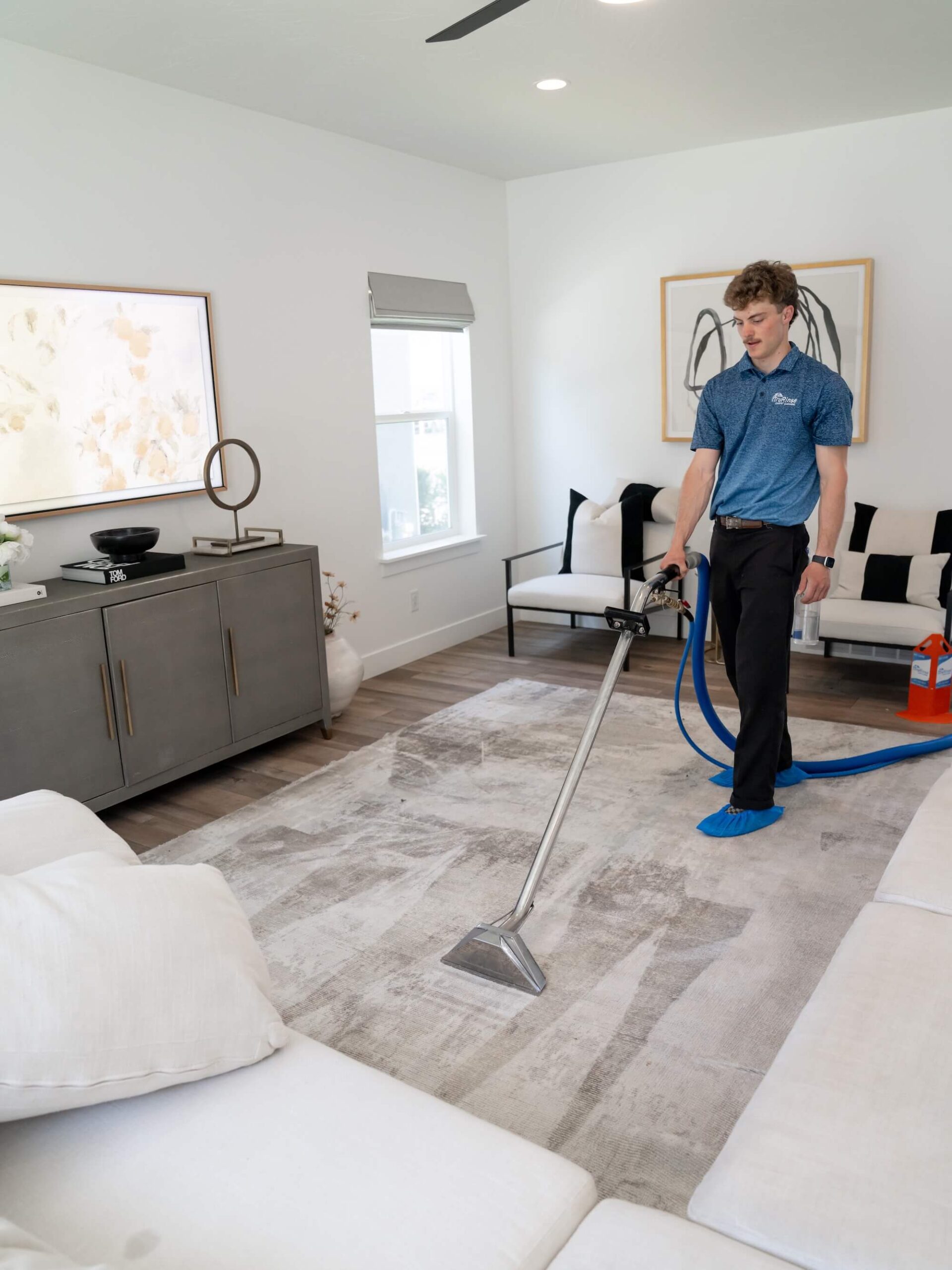 Orem City Hero Mobile man performing professional carpet cleaning on white bedroom carpet